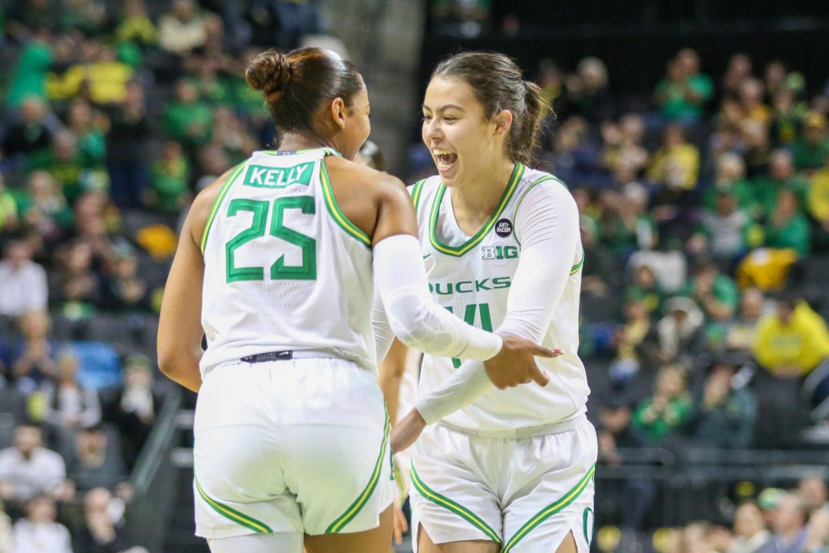 Ari Long (14) and Deja Kelly (25) celebrate. Oregon Women’s Basketball takes on Rutgers in Eugene, Ore. on Feb. 23, 2025.