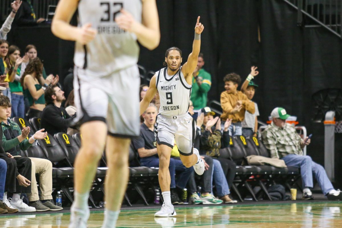 Keeshawn Barthelemy (9) celebrates a three point shot. Oregon Men’s Basketball takes on Northwestern in Eugene, Ore. on Feb. 11, 2025.