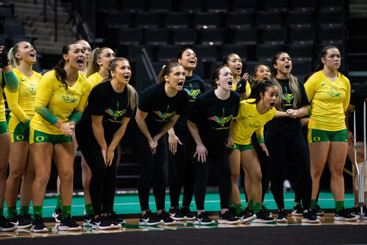 Oregon Athletes yelling at the sidelines during the routine. The University of Oregon Ducks Women’s Acrobatics and Tumbling team in a home match against Morgan State at Matthew Knight Arena in Eugene, Ore., on Feb. 15, 2025. (Rowan Campbell/Emerald).
