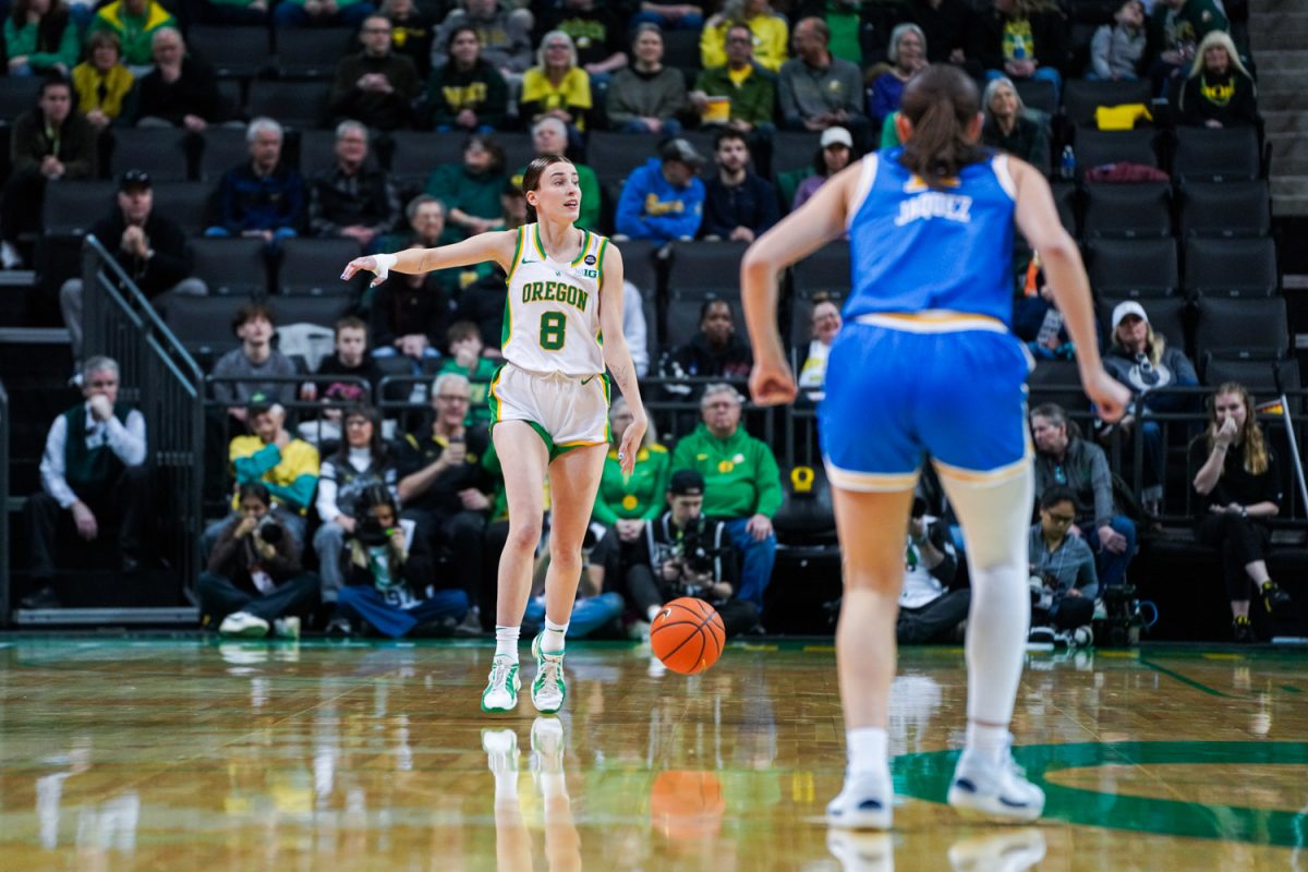 Elisa Mevius (8) points directions at her team mid court. The University of Oregon Ducks Women’s Basketball team lose to the UCLA Bruins (62-52) in a home match at Matthew Knight Arena in Eugene, Ore., on Feb. 9, 2025. (Rowan Campbell/Emerald).