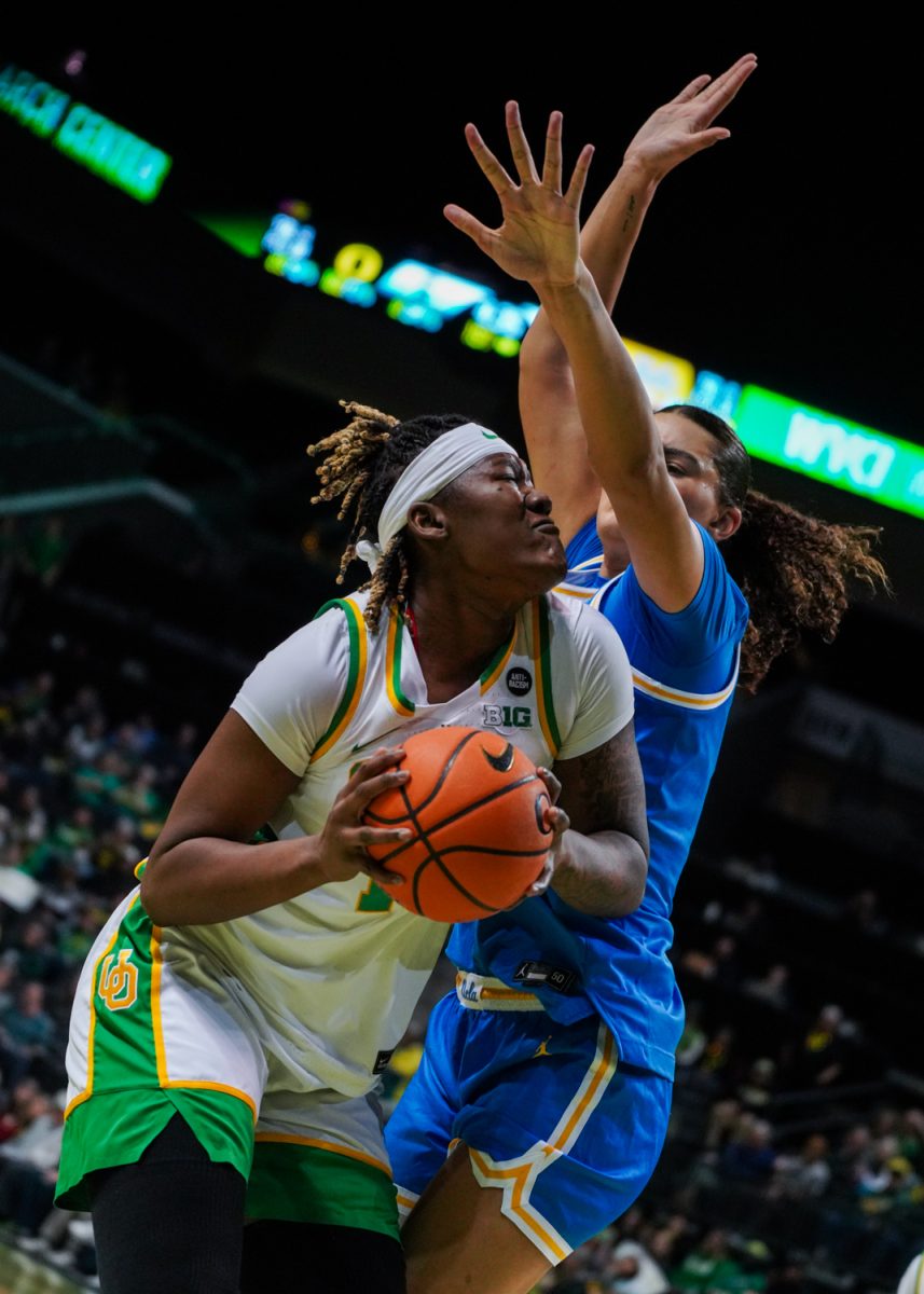 Phillipina Kyei (15) tries to get through Lauren Betts (51) for a layup. The University of Oregon Ducks Women’s Basketball team lose to the UCLA Bruins (62-52) in a home match at Matthew Knight Arena in Eugene, Ore., on Feb. 9, 2025. (Rowan Campbell/Emerald).