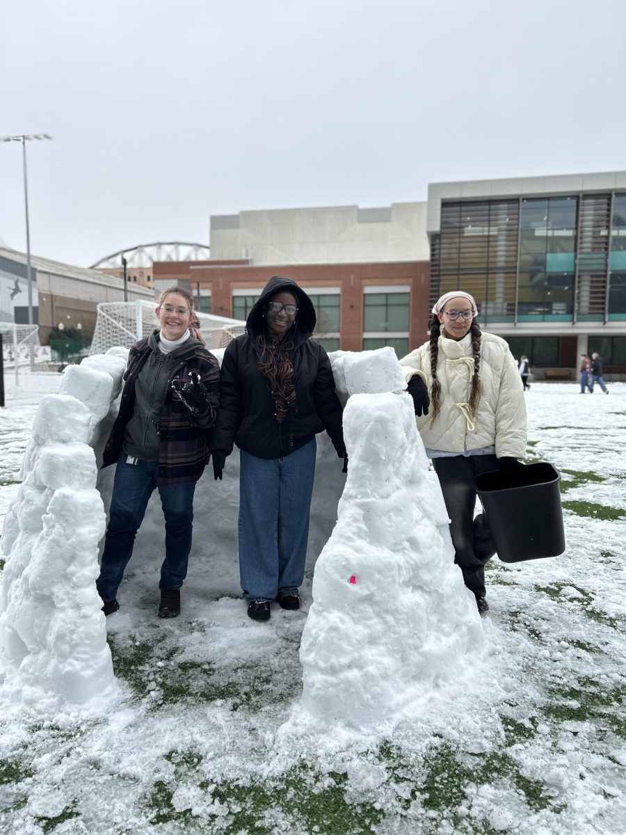 Freshmen Izzy Winston, Ava Bousquet and Lizbeth Bonsu are building an igloo.