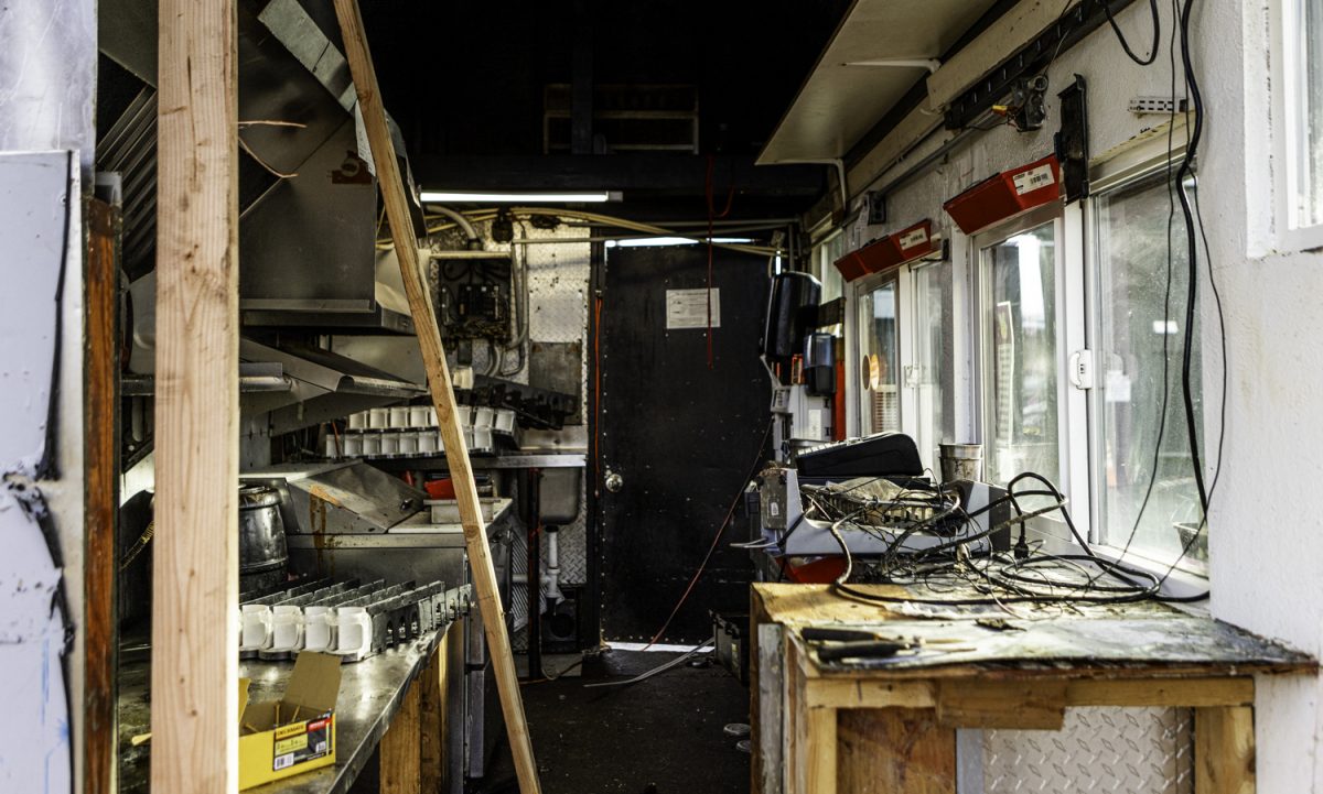 An interior view showing the ongoing reconstruction of the food cart. A car crashed into the Gotcha Burger food cart just before 2 p.m. on Feb. 5, 2025, and owner Trevon Huntley is currently rebuilding. (Max Unkrich/Emerald)