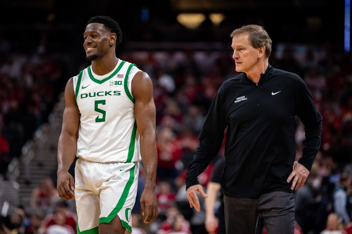 TJ Bamba (5) shares a moment with his coach as the game clock makes its way to zero, bringing the Ducks to the next round of the Big Ten Tournament. The Oregon Ducks face the Indiana Hoosiers for the second round of the Big Ten Tournament in the Gainbridge Fieldhouse, Indianapolis, IN, Mar 13 2025. (Jonathan Suni/Emerald)