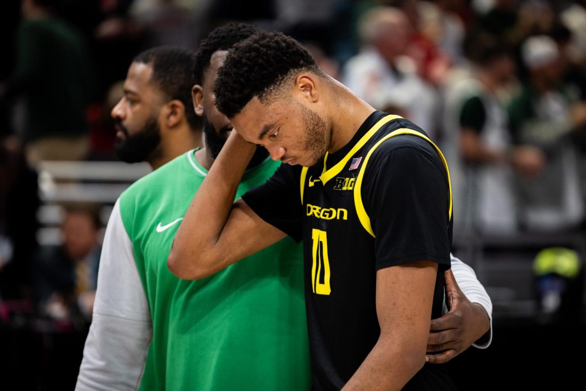 Kwame Evans Jr (10) and the Oregon Ducks walk off the court as their Big Ten Tournament run comes to an end. The Oregon Ducks take on the Michigan State Spartans in the second round of the Big Ten Tournament at Gainbridge Fieldhouse in Indianapolis, IN, on March 14, 2025. (Jonathan Suni/Emerald)