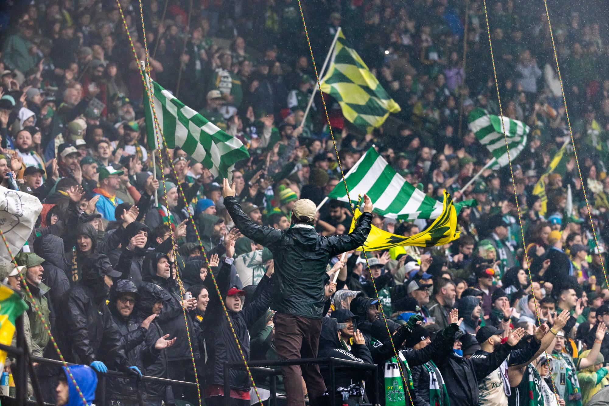 Despite heavy rain, Timbers Army fills the stadium with cheers as they welcome their team back to action after falling short early in the playoffs last season. The Portland Timbers Football Club hosts the Vancouver Whitecaps to start off their 50th season at Providence Park in Portland, Ore., on Mar. 5, 2025. (Jonathan Suni/Emerald)