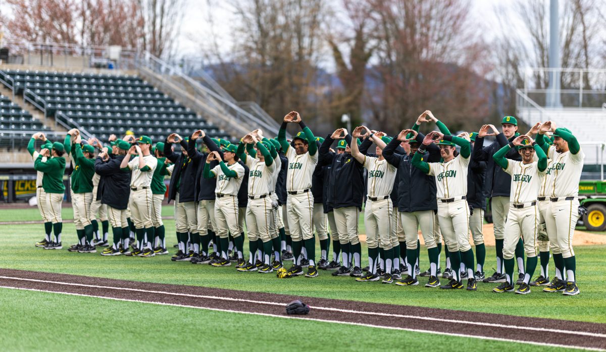 University of Oregon players salute the crowd with the 'O' after securing a victory at PK Park. The University of Oregon baseball team defeated Columbia University 7-0 on Mar. 2, 2025 at PK Park in Eugene, Ore. (Max Unkrich / Emerald)