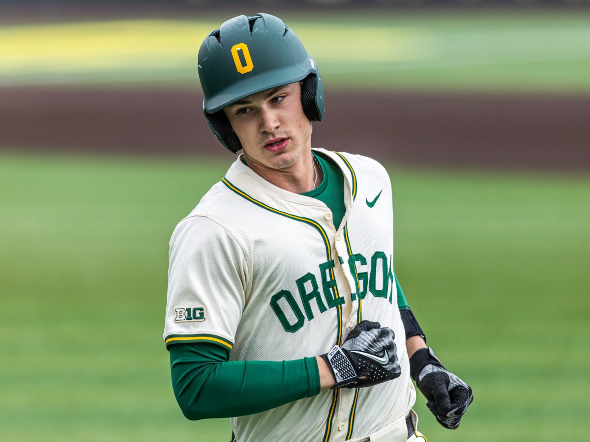 University of Oregon infielder Maddox Molony (9) heads back to the dugout after scoring a run. The University of Oregon baseball team defeated Columbia University 7-0 on Mar. 2, 2025 at PK Park in Eugene, Ore. (Max Unkrich / Emerald)