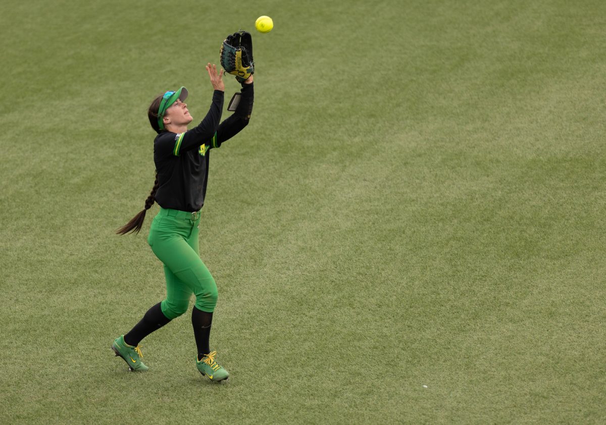 Oregon outfielder Kedre Luschar (1) catches a deep hit to the left field. The University of Oregon Ducks defeated the Loyola Chicago Ramblers 9-1 on March 2, 2025, at Jane Sanders Stadium. The Ducks Will next play the Flordia State Seminoles on March 8. (Miles Cull/Emerald)