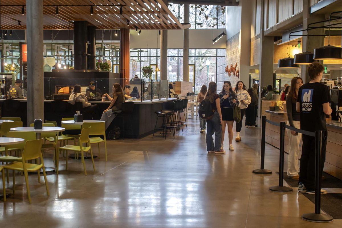 Students walk through the Unthank Dining Hall on the first level of the residence hall in Eugene, Ore. (Alyssa Garcia/Emerald)
