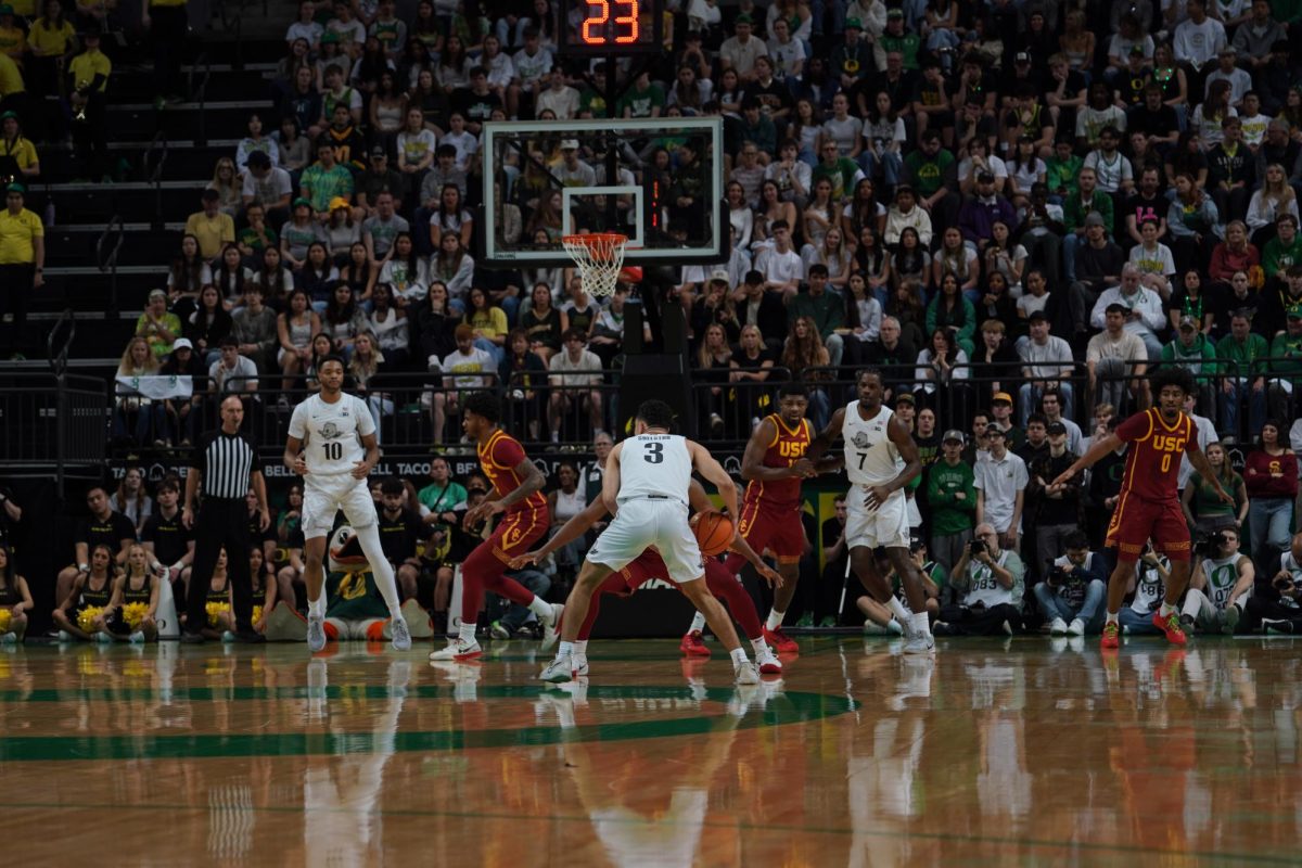 Jackson Shelstad, a guard for the Ducks, looks for his teammates to make a play for a basket. The Oregon Ducks Men's Basketball took on the University of Southern California Trojans in Matthew Knight Arena on March 1, 2025 in Eugene, Ore. (Saj Sundaram/Emerald)