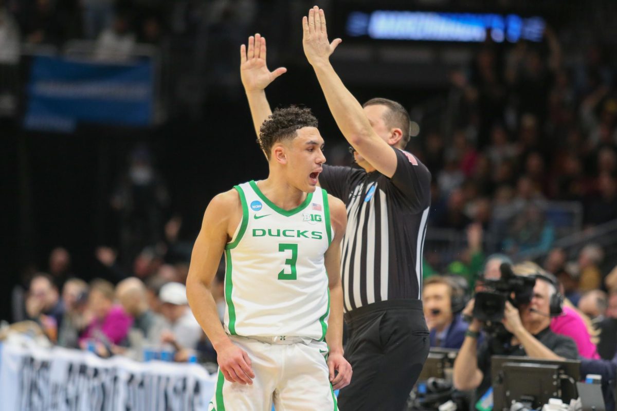 Jackson Shelstad (3) celebrates a three point basket at the end of the first half. Oregon Basketball takes on Liberty in the first round of the NCAA Tournament in Seattle, Wa. on Mar 21, 2025.