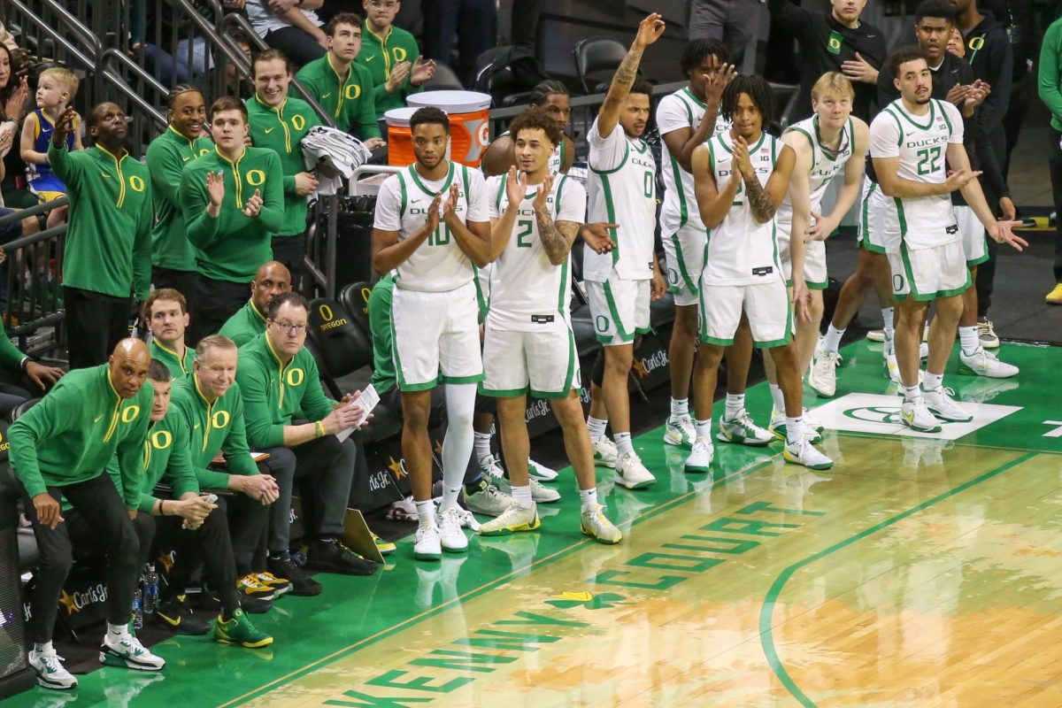 The Oregon bench celebrates Keeshawn Barthelemy's three. Oregon Men’s Basketball takes on Indiana in Eugene, Ore. on Mar. 4, 2025.