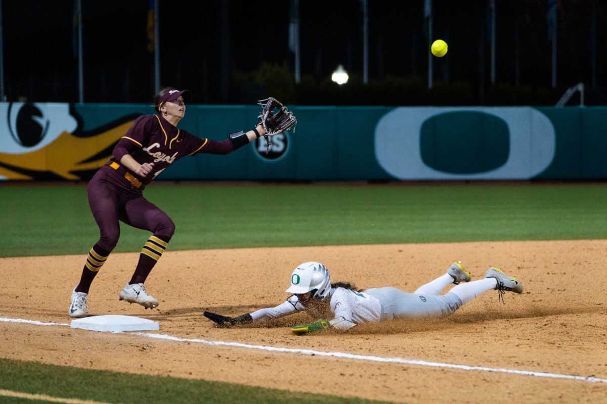 Kai Luschar (22) slides for the third base. The University of Oregon Ducks Women’s Softball team in a home match against Loyola Chicago at Jane Sanders Field in Eugene, Ore., on Mar. 1, 2025. (Rowan Campbell/Emerald).