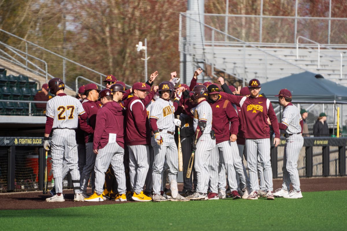 The Minnesoda baseball team meets before starting the game. The University of Oregon Ducks Mens Baseball team win 5-2 in a home match against the Minnesota Gophers at PK Park in Eugene, Ore., on Mar. 14, 2025. (Rowan Campbell/Emerald).