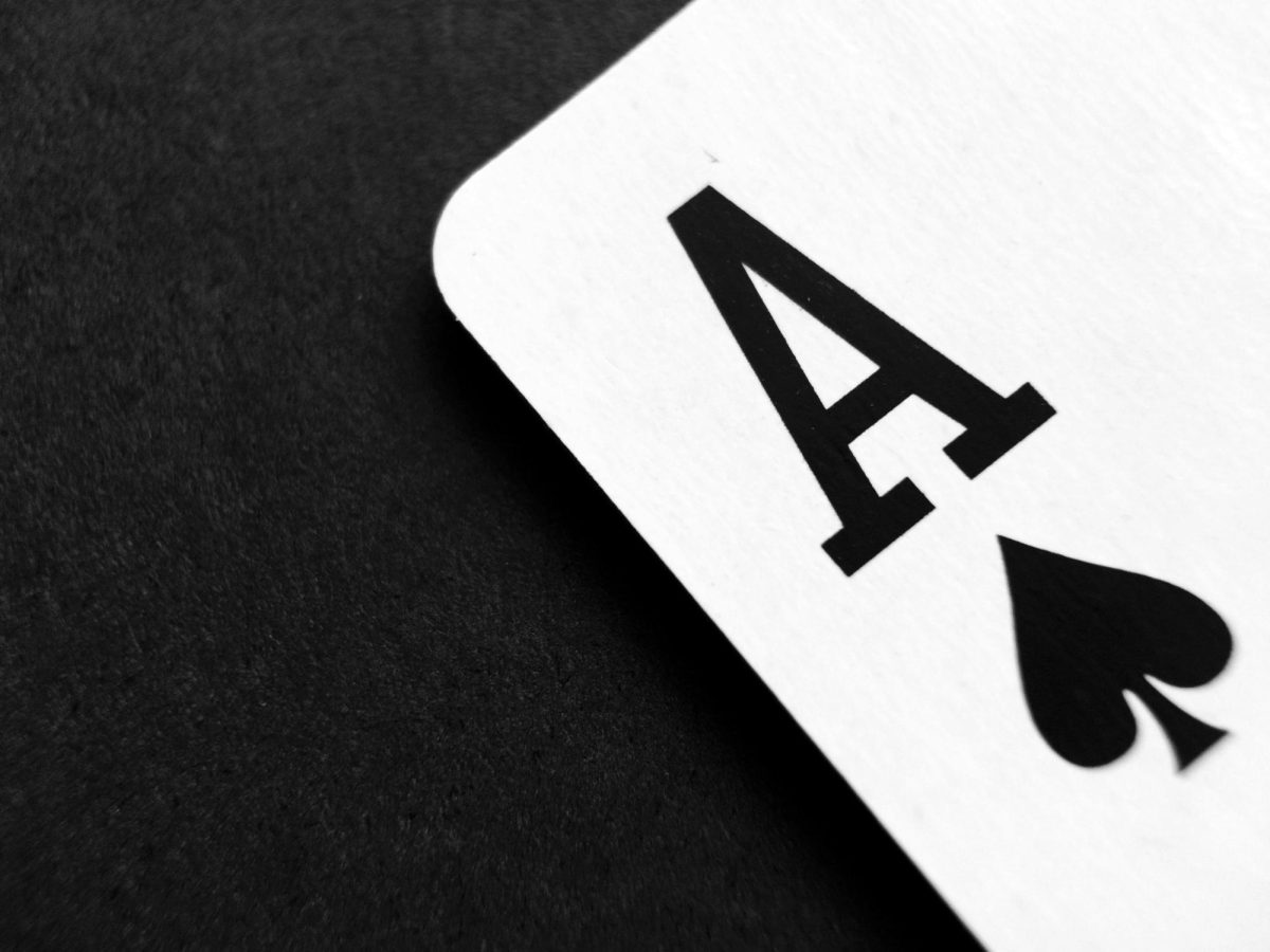 https://www.pexels.com/photo/ace-of-spade-playing-card-on-grey-surface-262333/