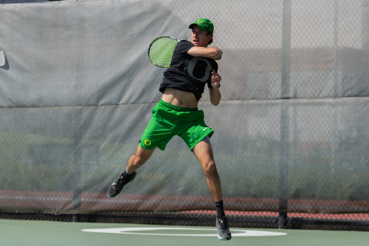 Lachlan Robertson mid swing to return the ball across the net. Oregon Men’s Tennis come away victorious with a 4-1 defeat over Northwestern in Eugene, Ore., on April 20, 2025, securing their spot in the Big Ten Tournament. (Julia Massa/Emerald)