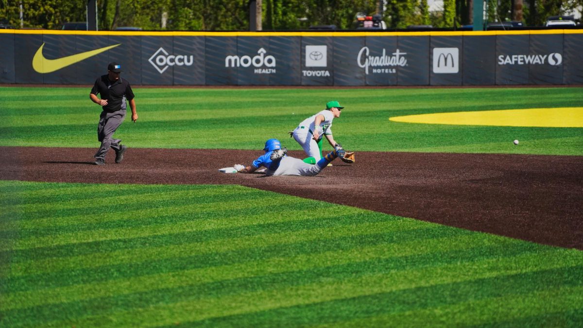 UCLA player dives to second base. UCLA (10th) takes game two in the series over the Ducks (16th) 14-4 on April 19th, 2025.  (JR Quint/ Emerald)