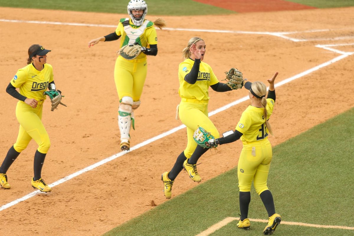 Lyndsey Grein skips into a high five after a big play in the second inning. Oregon Softball takes on Stanford in the NCAA Softball Regionals in Eugene, Ore. on May 17, 2025.