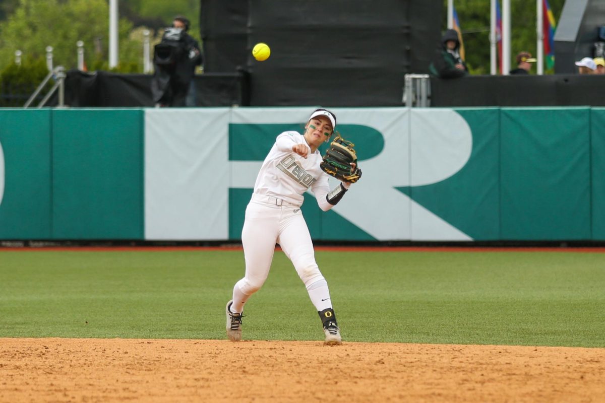 Kaylynn Jones makes an athletic play to throw out a Cardinal runner at first. Oregon Softball takes on Stanford in the NCAA Softball Regionals in Eugene, Ore. on May 18, 2025.