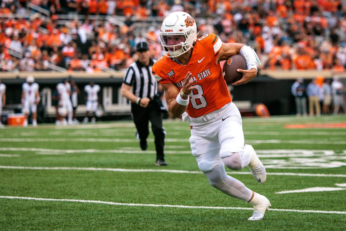 Aug 28, 2025; Stillwater, Oklahoma, USA; Oklahoma State Cowboys quarterback Hauss Hejny (8) runs the ball during the first half against the Tennessee Martin Skyhawks at Boone Pickens Stadium. Mandatory Credit: William Purnell-Imagn Images