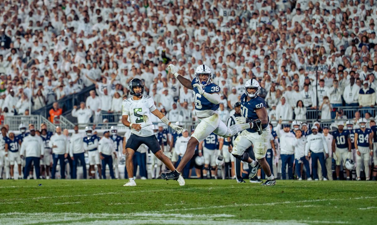 Penn State Nittany Lions defensive end Zuriah Fisher (36) jumps to block a pass from Oregon Ducks quarterback Dante Moore (5). On September 27, 2025 the University of Oregon Ducks played the Penn State University Nittany Lions at Beaver Stadium in State College, Pa. (Saj Sundaram/Emerald)