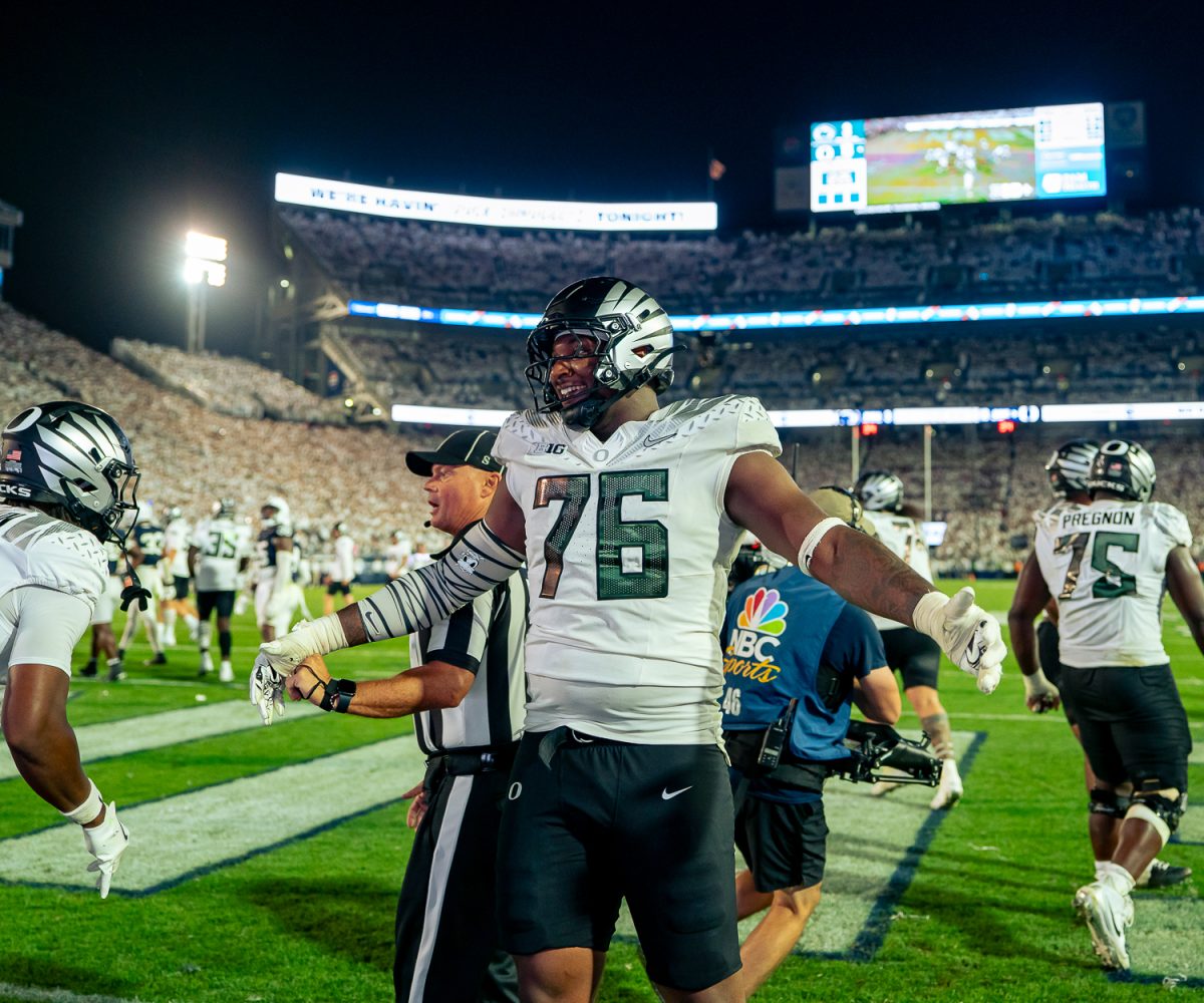 Oregon Ducks offensive lineman Isaiah World (76) celebrates after the Ducks score a touchdown. On September 27, 2025 the University of Oregon Ducks played the Penn State University Nittany Lions at Beaver Stadium in State College, Pa. (Saj Sundaram/Emerald)
