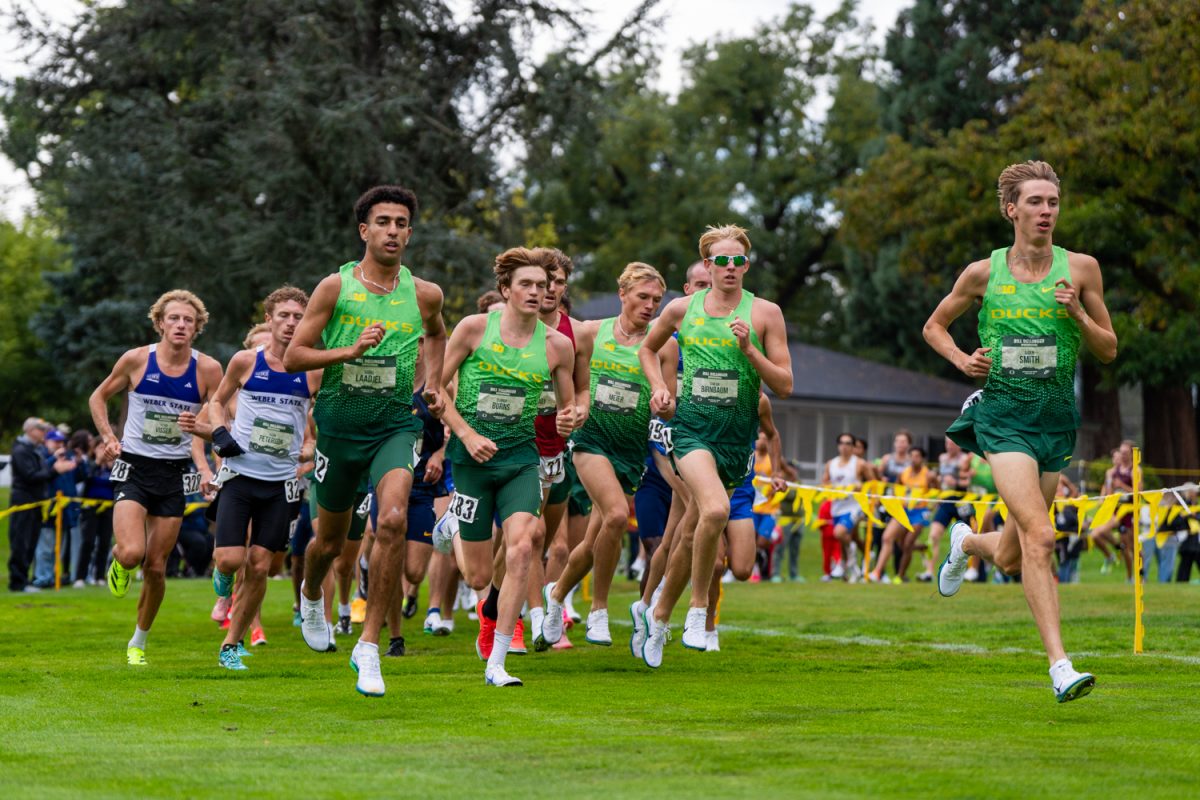 The Oregon men lead the front pack of the men's 8k with standouts Aiden Smith, Simeon Birnbaum and Connor Burns. The University of Oregon Ducks Cross Country Team win convincingly at home in the Bill Dellinger Invitational in Springfield, Ore., on Oct. 10, 2025. (Rowan Campbell/Emerald).