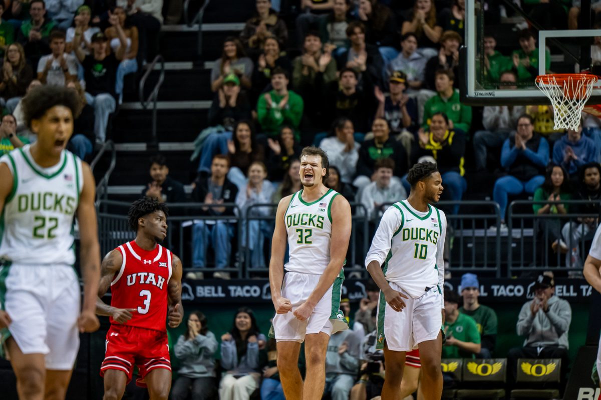 University of Oregon Ducks center Nate Bittle (32) celebrates a score off of the rebound. Oregon Men’s Basketball takes on the University of Utah Men’s Basketball at Mathew Knight Arena in Eugene, Ore. on Oct. 24, 2025. (Paul Leachman / Emerald)