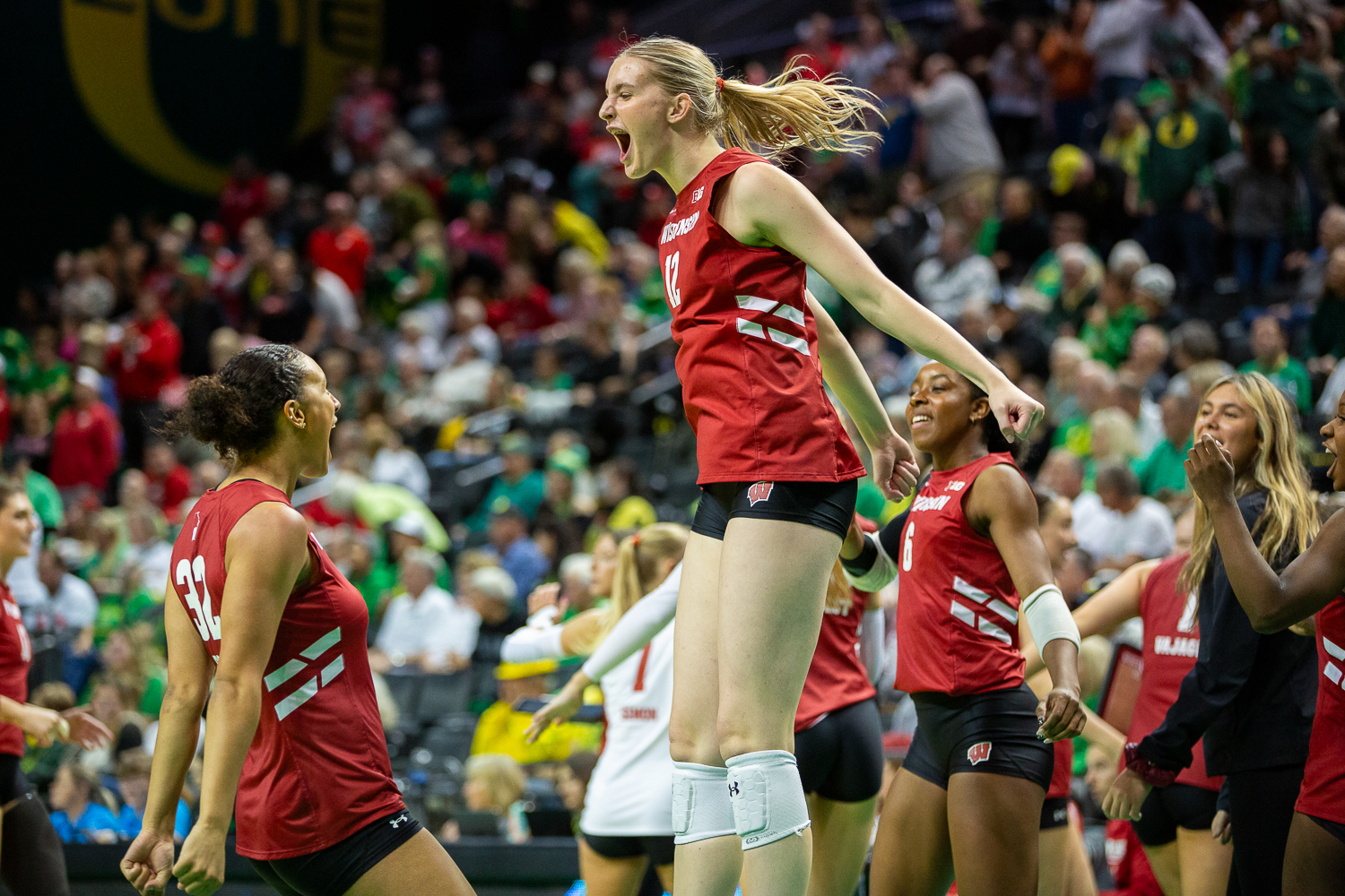 Natalie Wardlow (12) and Grace Egan (32) celebrate during a time-out. Oregon volleyball faces the Wisconsin Badgers at Matthew Knight Arena in Eugene, Ore. on October 26, 2025. (Heidi Thalman/Emerald)