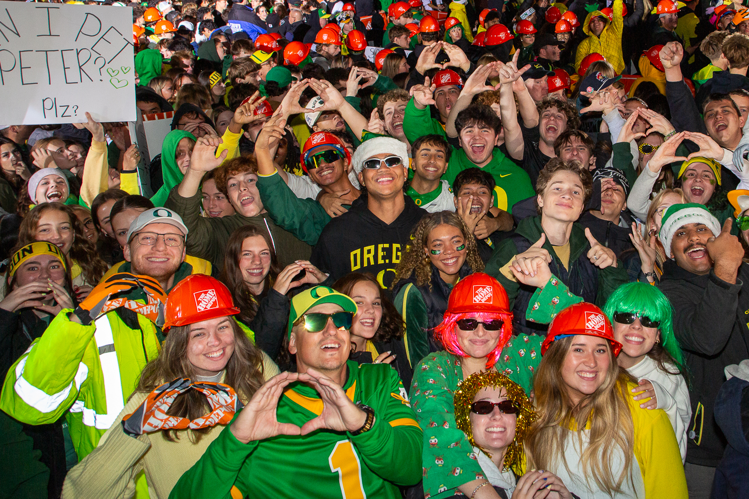 Duck fans in the pit pose one hour before ESPN’s live broadcast begins. The University of Oregon hosts ESPN's "College GameDay" for the Oregon Ducks football game against Indiana University, being played at Autzen Stadium in Eugene, Ore. on Oct. 11, 2025. (Corey Hoffman/Emerald)