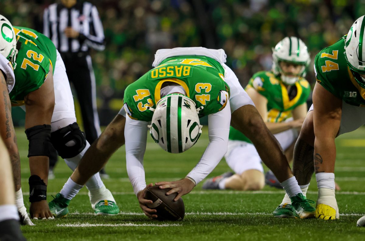 Luke Basso (43) to snap the ball during the Ducks point after attempt. The University of Oregon Ducks host the University of Minnesota Gophers in a Friday night matchup on Nov. 14, 2025, at Autzen Stadium in Eugene, Ore. (Julia Massa/Emerald)