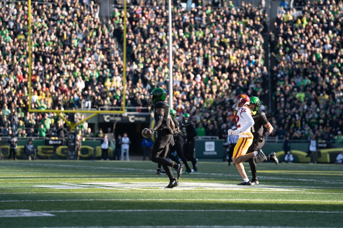 Duck wide reciever Malik Benson (4) celebrates his turnover in the third quarter. The University of Oregon Ducks took on West Coast rival the USC Trojan's in a game at Autzen Stadium in Eugene, Ore. on Nov. 22, 2025. (Katie Poluyansky/Emerald)
