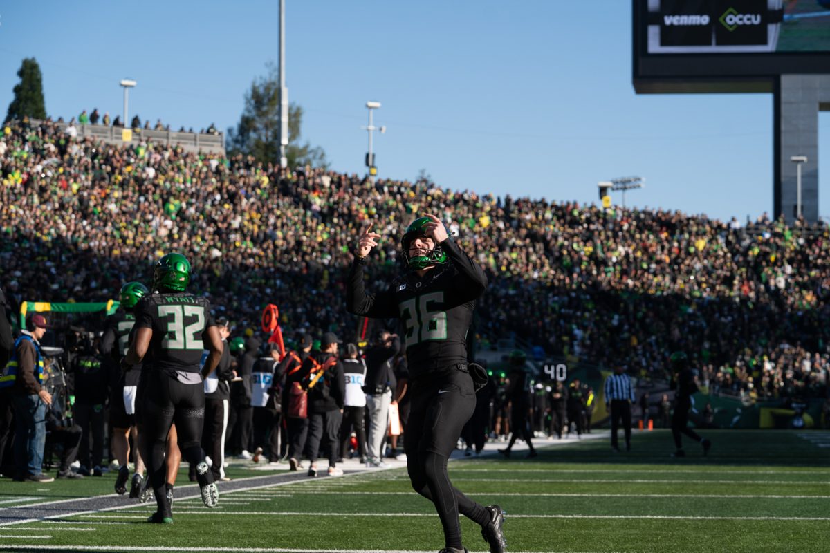 Duck kicker Atticus Sappington (36) hypes up the student section after making his kick. The University of Oregon Ducks took on West Coast rival the USC Trojan's in a game at Autzen Stadium in Eugene, Ore. on Nov. 22, 2025. (Katie Poluyansky/Emerald)