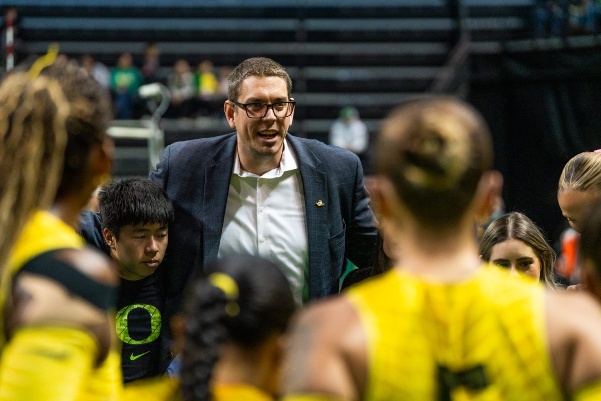 Oregon HC Trent Kersten addresses the team before the match. The University of Oregon Ducks Women's Volleyball team play the University of Michigan Wolverines in a home match at Matthew Knight Arena in Eugene, Ore., on Nov. 22, 2025. (Rowan Campbell/Emerald).