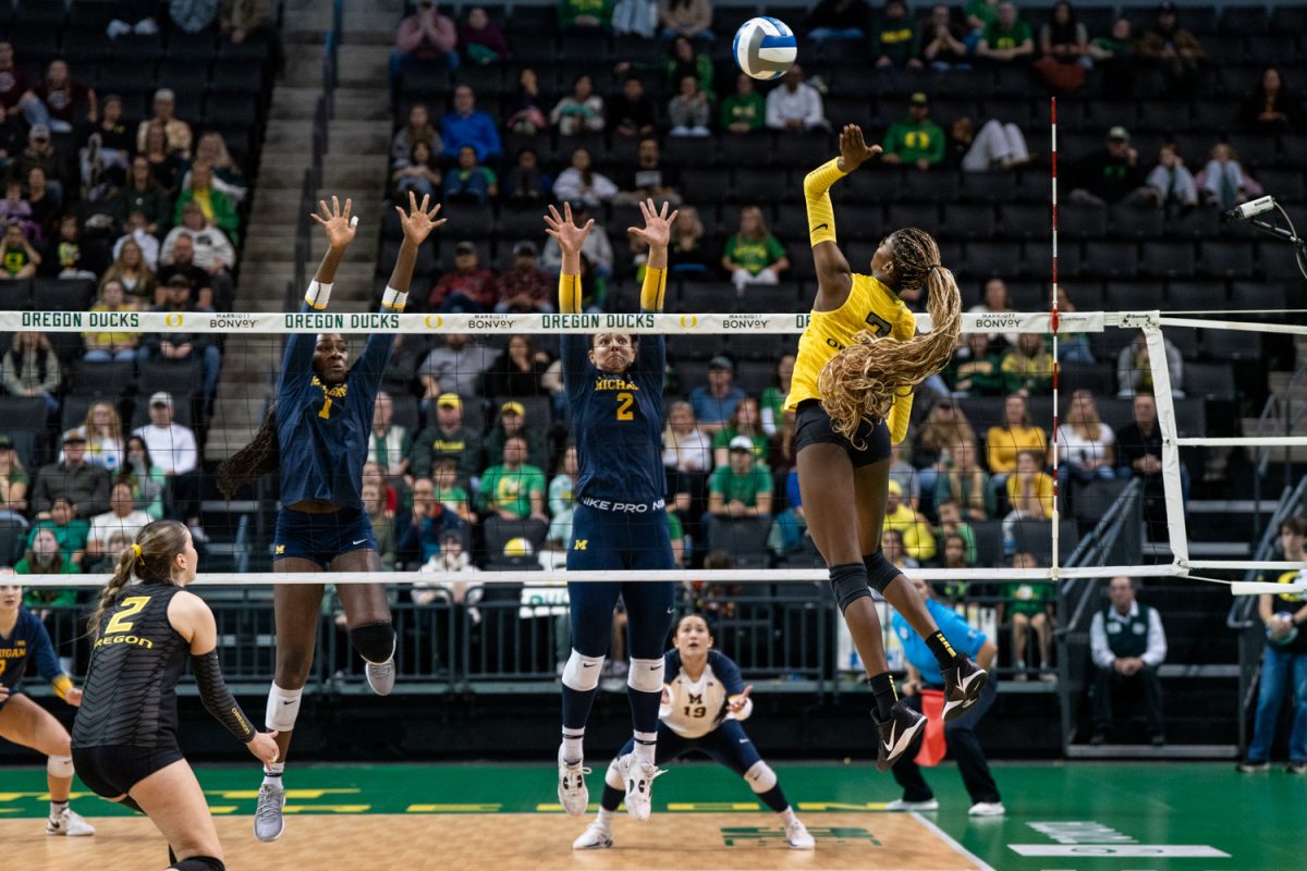 Oregon opposite hitter 
Alanah Clemente (7) jumps to drive the ball down for a point. The University of Oregon Ducks Women's Volleyball team lose to the University of Michigan Wolverines (1-3) in a home match at Matthew Knight Arena in Eugene, Ore., on Nov. 22, 2025. (Rowan Campbell/Emerald).