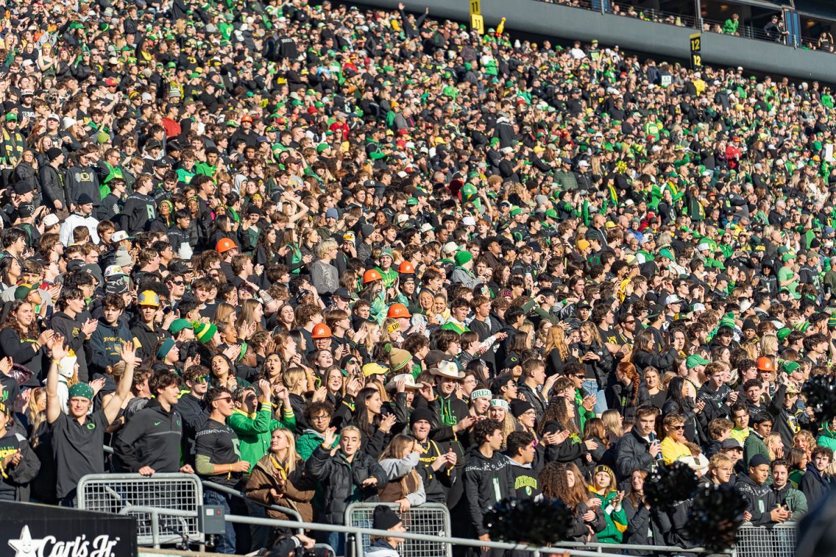 The students in the University of Oregon student section cheer for the Ducks after a touchdown. The No. 7 University of Oregon Ducks take on West Coast rivals, the No. 15 USC Trojans in a game at Autzen Stadium in Eugene, Ore. on Nov. 22, 2025. The Ducks won the game 42-27, with tight end Kenyon Sadiq having six catches for 72 yards and running back Noah Whittington ran for 104 yards. (Saj Sundaram/Emerald)