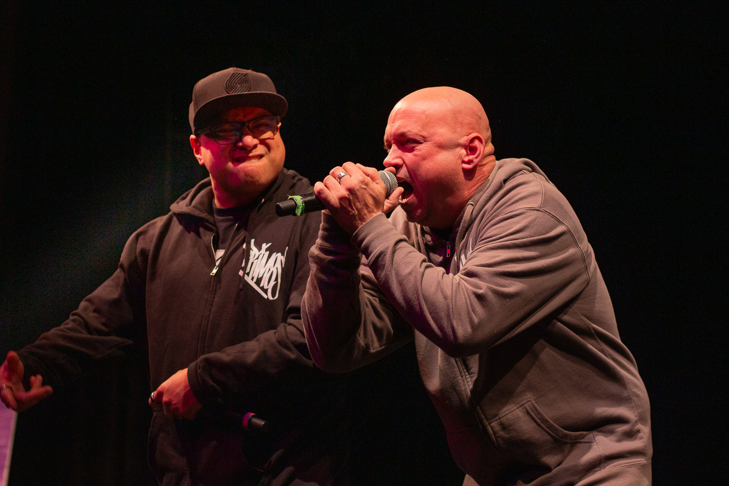 Steve and Kenny of the local Eugene hip-hop group “Prim8s” go back and forth while preforming some of their tracks. On December 4, 2025, the UO Hip-Hop Jam hosted their 12th annual event in the EMU Ballroom, at University of Oregon, based in Eugene, Ore. (Fred Hall/Emerald)