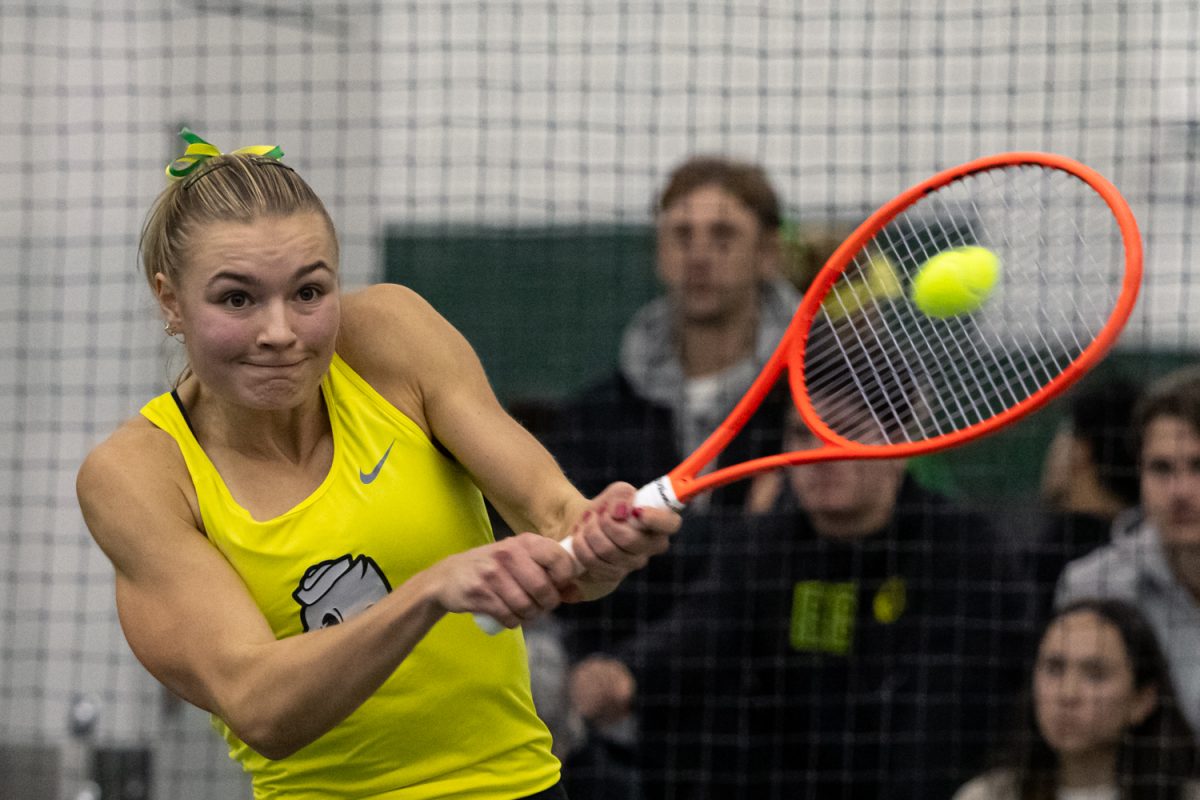 Tilde Jagare swings through the ball with her backhand. The University of Oregon Women's tennis team started their season against Portland State University at the Student Tennis Center in Eugene, Ore, on January 16, 2026. (Owen Burriss/Emerald)