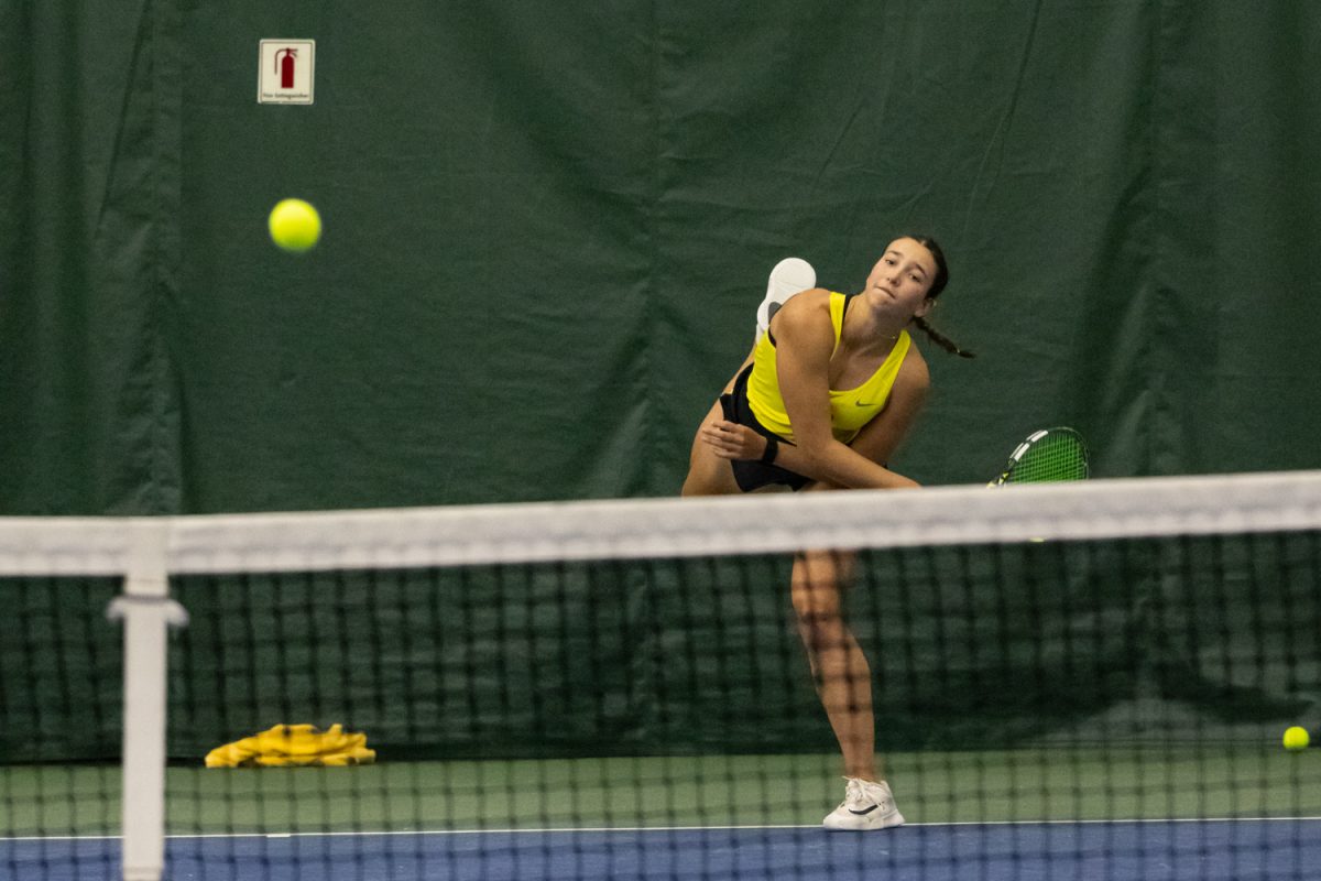 Virginia Croker follows through on her serve. The University of Oregon Women's tennis team started their season against Portland State University at the Student Tennis Center in Eugene, Ore, on January 16, 2026. (Owen Burriss/Emerald)