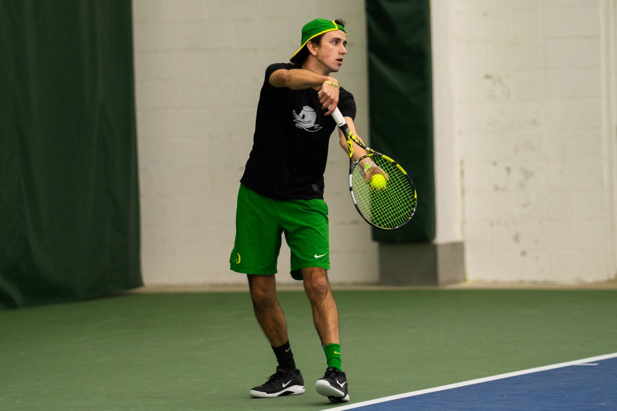 University of Oregon freshman Sam Olszakowski preprares to serve to the opponents. On Janurary 17, 2026, the University of Oregon's men's tennis team played against the University of Portland in the student tennis center in Eugene, Ore. (Katie Poluyansky/Emerald)