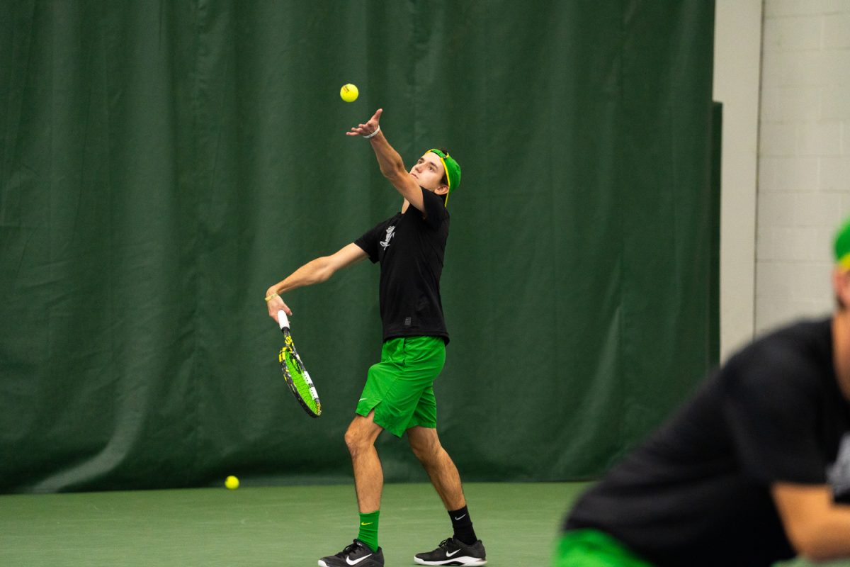 Duck senior Lachlan Robertson prepares to serve a powerful ball. On Janurary 17, 2026, the University of Oregon's men's tennis team played against the University of Portland in the student tennis center in Eugene, Ore. (Katie Poluyansky/Emerald)
