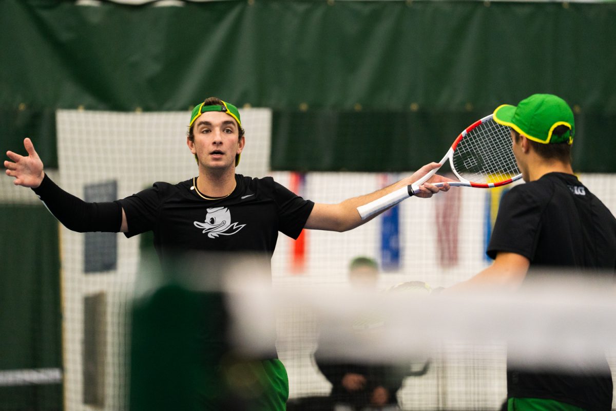 University of Oregon freshman Declan Galligan celebrates after an unexpected point. On Janurary 17, 2026, the University of Oregon's men's tennis team played against the University of Portland in the student tennis center in Eugene, Ore. (Katie Poluyansky/Emerald)