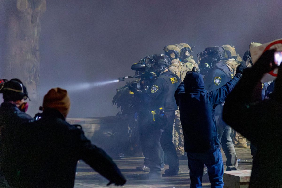 Federal agents deploy tear gas and flash bang grenades against protestors at Portland's ICE facility on Jan. 24, 2026 (Joy Edwards/Emerald). 