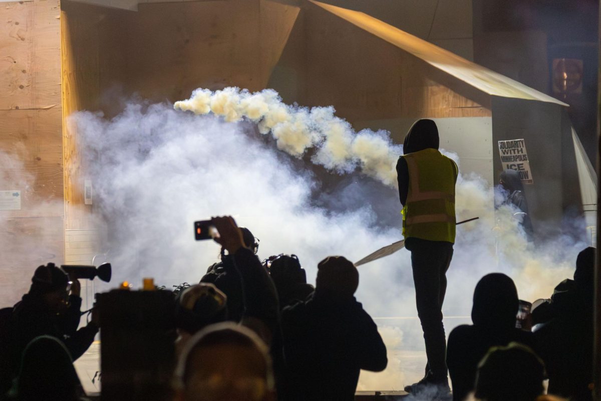 Federal agents deploy tear gas and flash bang grenades against protestors at Portland's ICE facility on Jan. 24, 2026 (Joy Edwards/Emerald). 