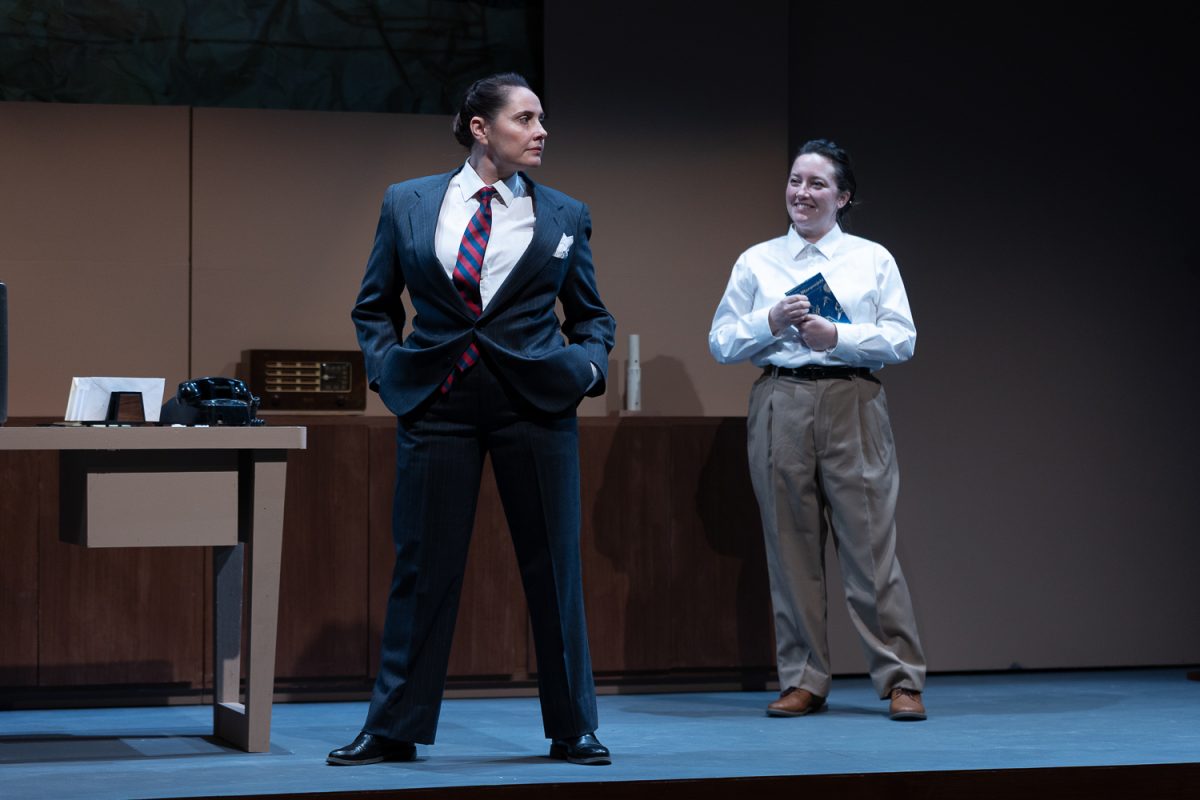 Katie Worley Beck as Wernher von Braun (left) and Kathleen Borrelli as Heinz-Hermann Koelle (right).