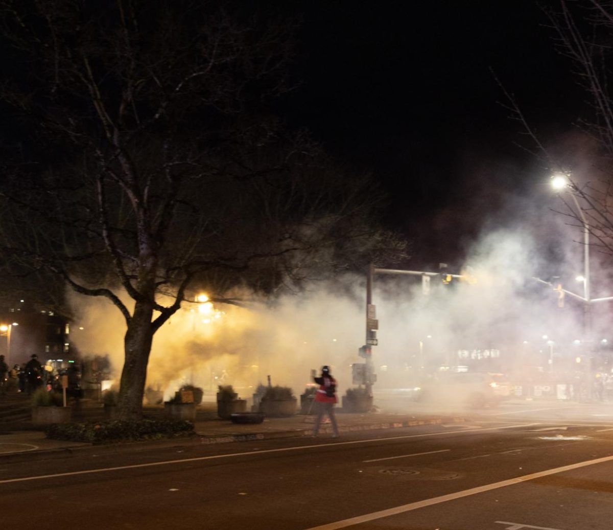 Tear gas fills the intersection of Seventh Avenue and Pearl Street after federal agents deployed chemical irritants, including pepper balls, flash-bang grenades and tear gas, against anti-ICE protesters outside the Eugene Federal Building in Eugene, Ore., Jan. 30, 2026. (Tarek Anthony/Emerald)