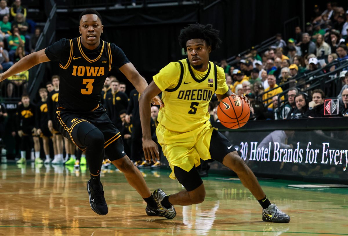 Duck Takai Simpkins (5) gets past his Hawkeye defender Cam Manyawu (3). On February 1, 2026, the Oregon Ducks hosted the Iowa Hawkeyes at Matthew Knight Arena in Eugene, Ore. (Julia Massa/Emerald)