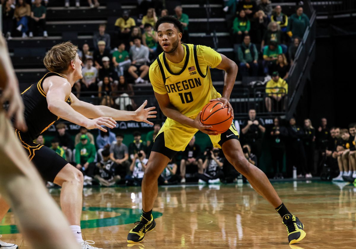 Kwame Evans Jr. (10), a junior forward for the Ducks, looks to move the ball around the court. On February 1, 2026, the Oregon Ducks hosted the Iowa Hawkeyes at Matthew Knight Arena in Eugene, Ore. (Julia Massa/Emerald)