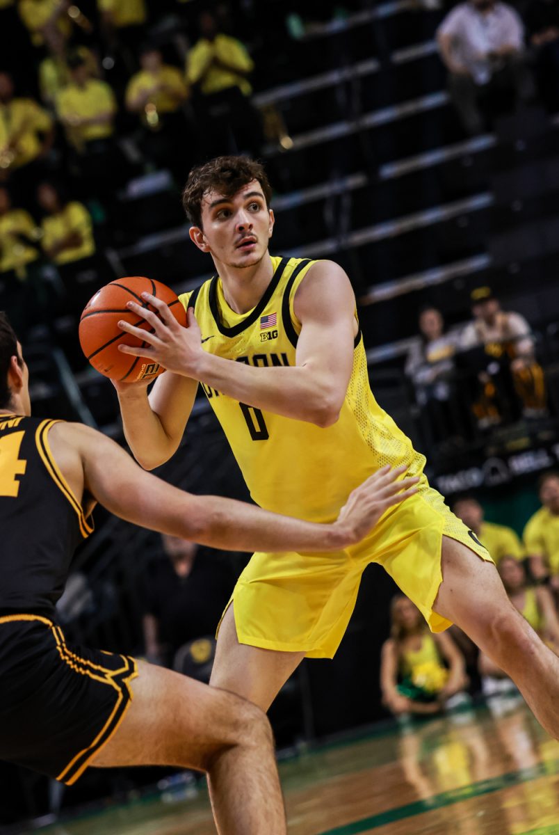 Duck Efe Vatan (0) attempts to pass the ball around his Hawkeye defender Cooper Koch (8). On February 1, 2026, the Oregon Ducks hosted the Iowa Hawkeyes at Matthew Knight Arena in Eugene, Ore. (Julia Massa/Emerald)